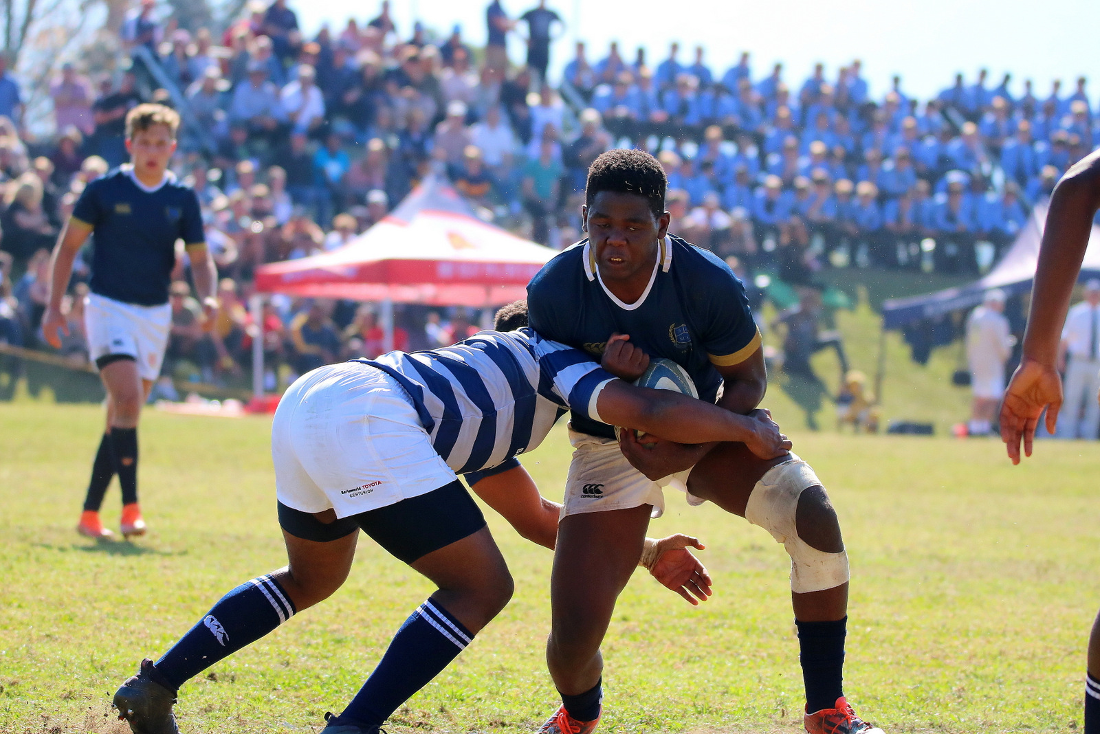 st charles rugby player braising for a tackle