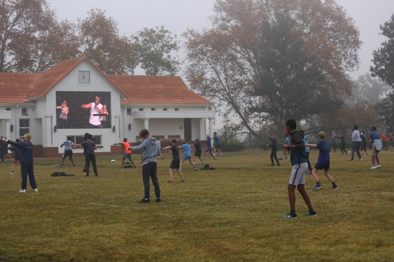st charles students doing a workout on the field