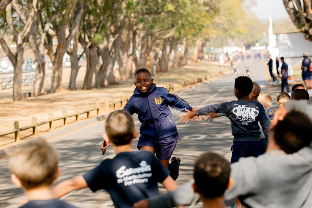 Primary School boys running in the founders day relay race
